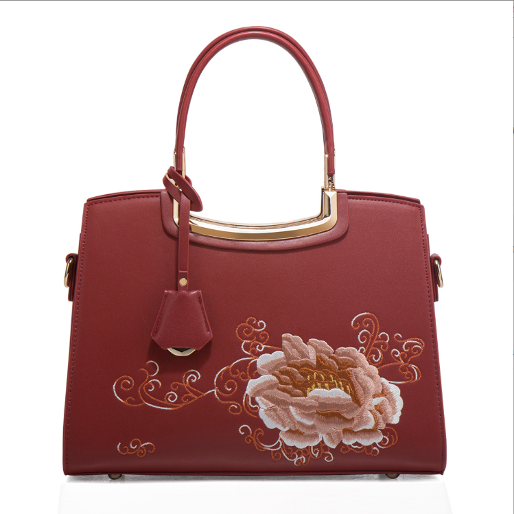 Ladies Elegant Burgundy Handbag with Floral Embroidery And Gold-Tone Hardware